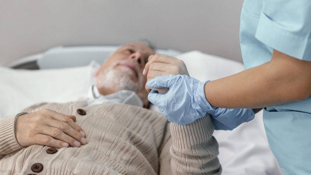 holding hand of patient